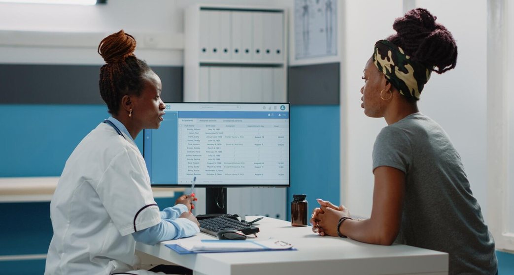 Clinician consulting with a patient